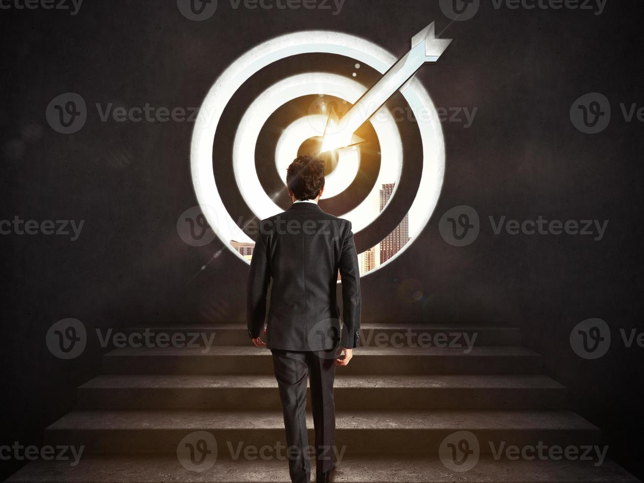 Arrive at a goal of success. Businessman climbing the stairs up to a target.. 3D Rendering photo