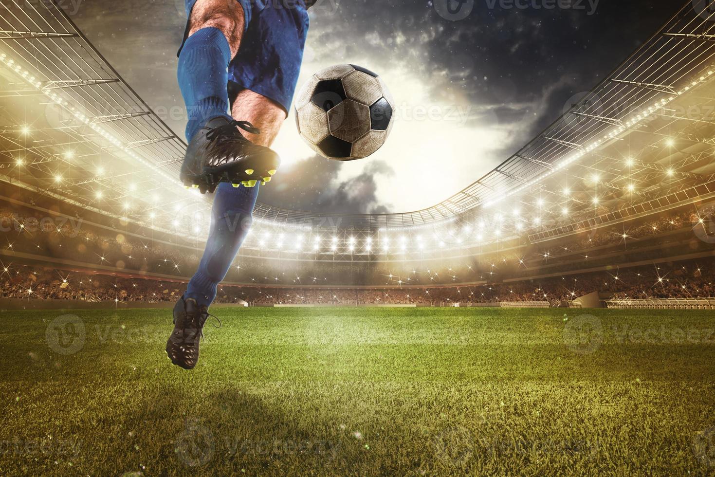 Close up of a striker who kicks the ball to make goals at the stadium during a soccer game photo