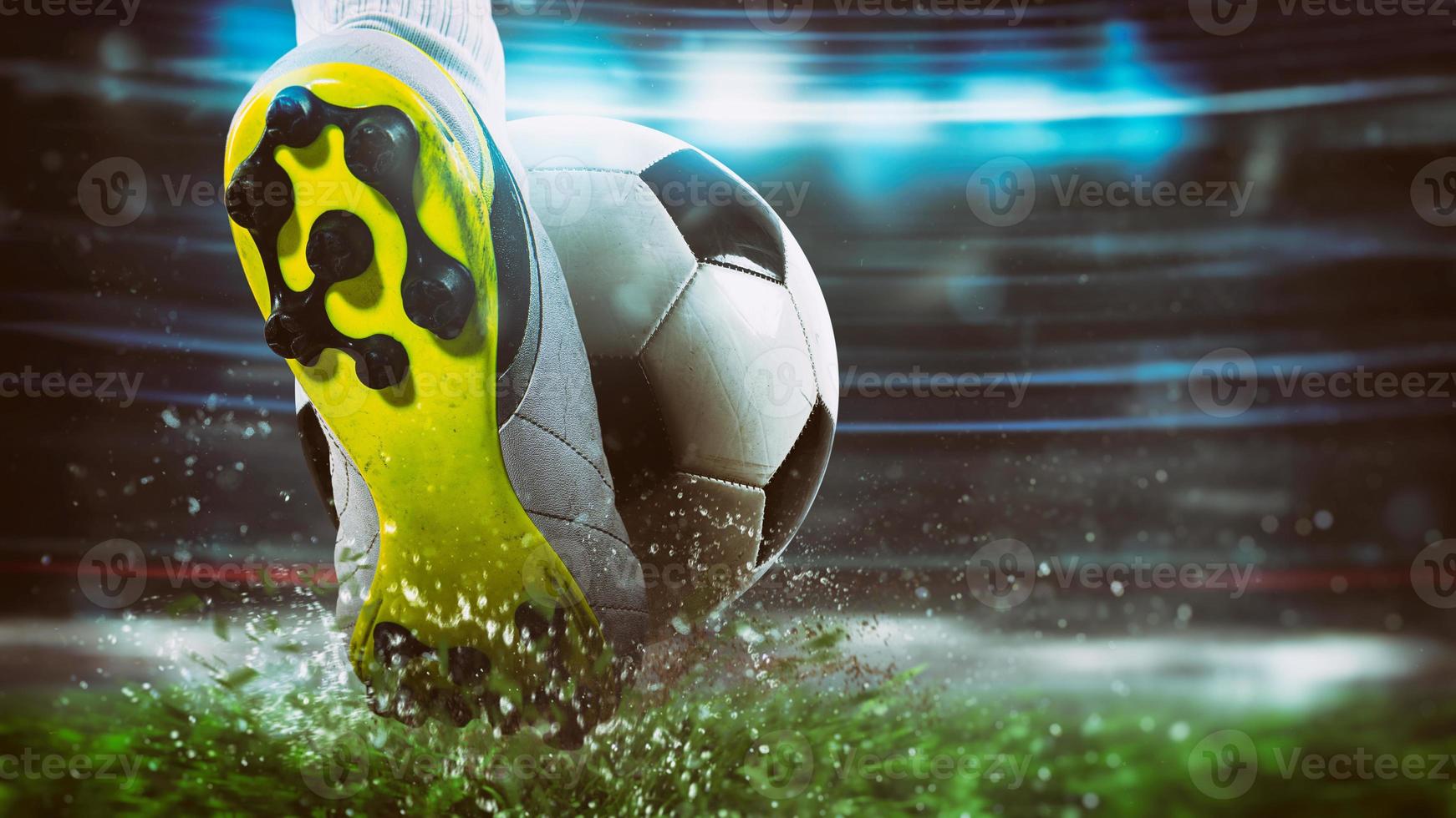 Football scene at night match with close up of a soccer shoe hitting the ball with power photo