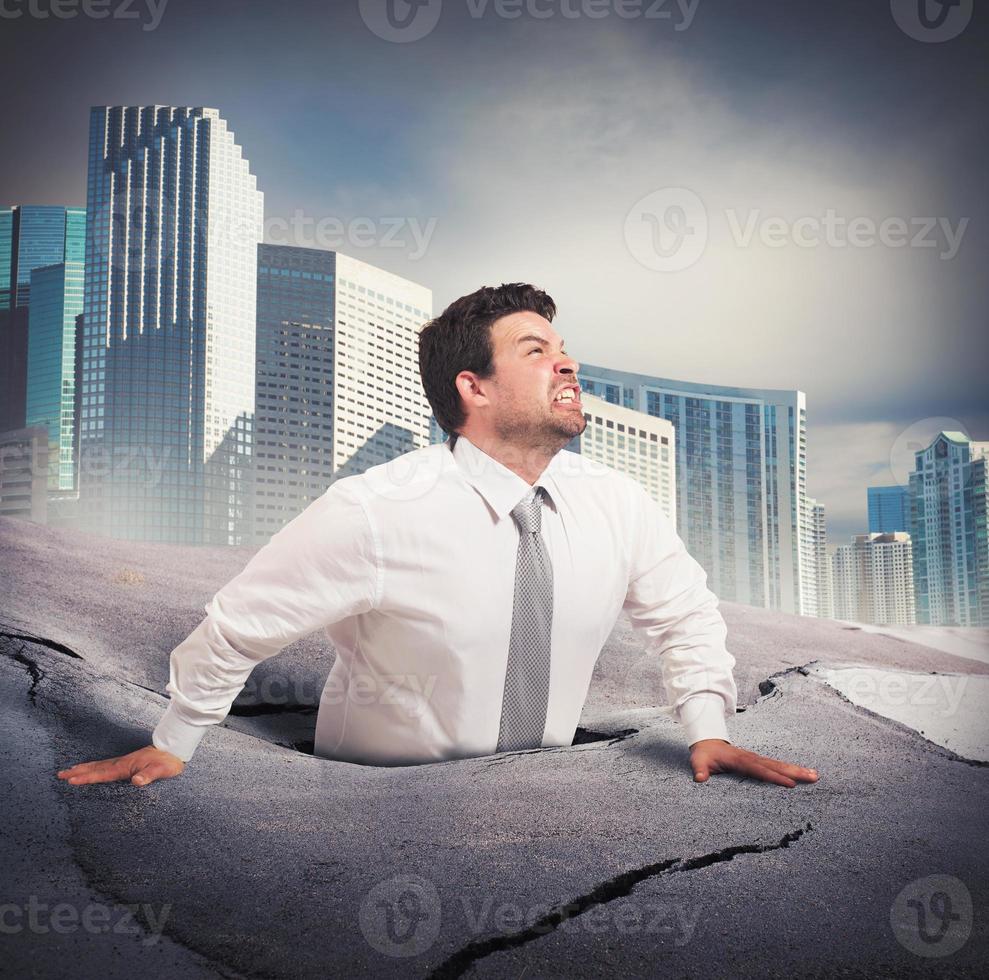 Businessman sinks into despair photo