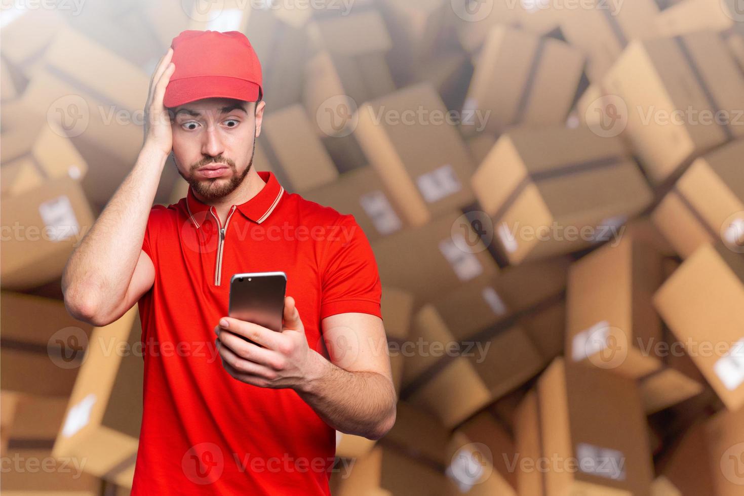 Courier is confused due to a lot of packages to deliver. concept of overwork and internet order photo