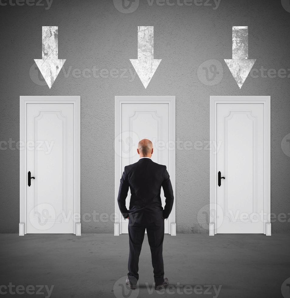 Concept of businessman choosing the right door photo