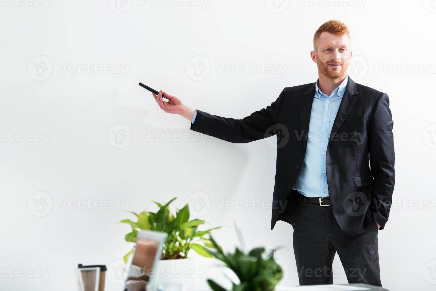 Businessman in office explain something at a training meeting photo
