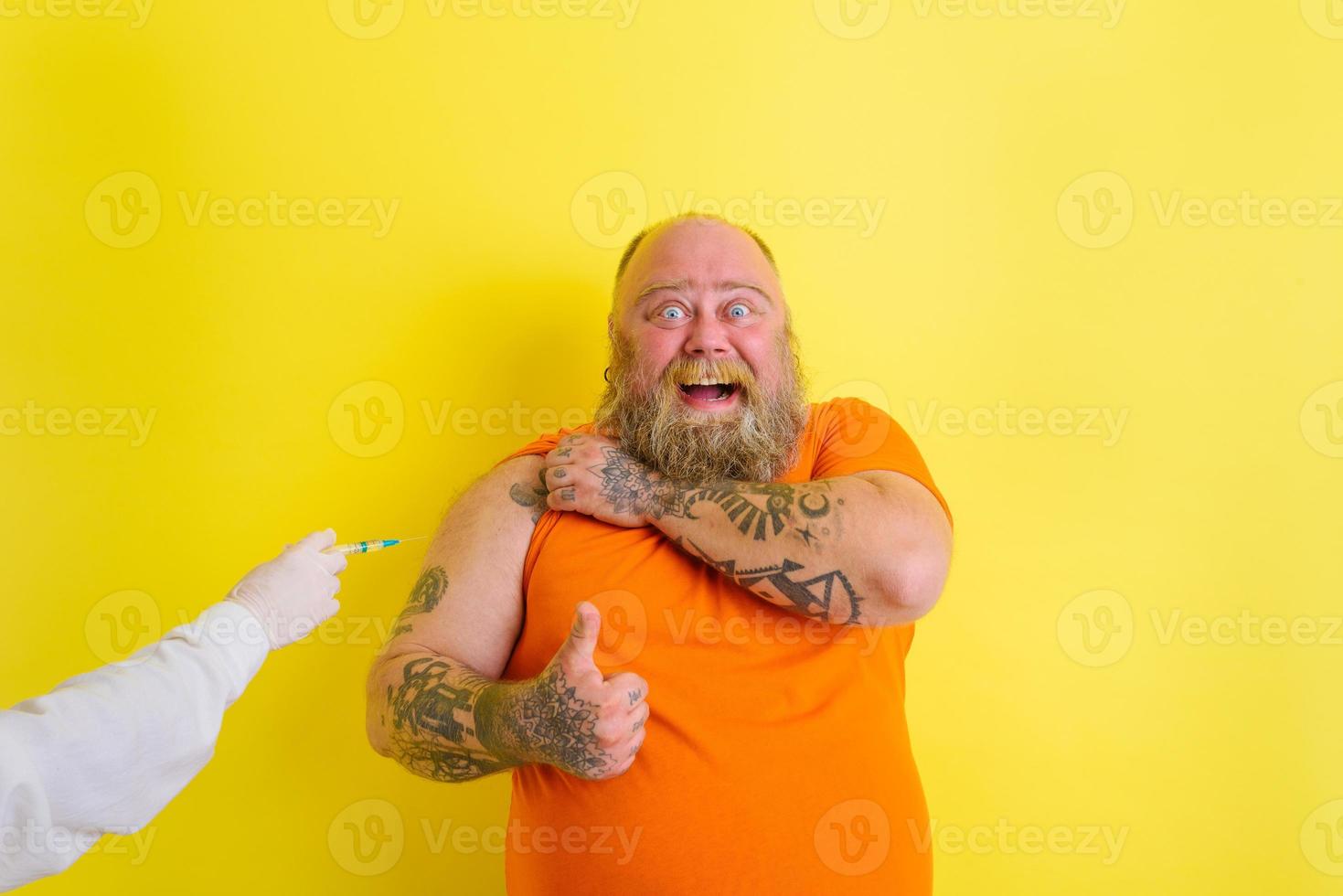 Happy man is happy of getting the covid-19 vaccine photo