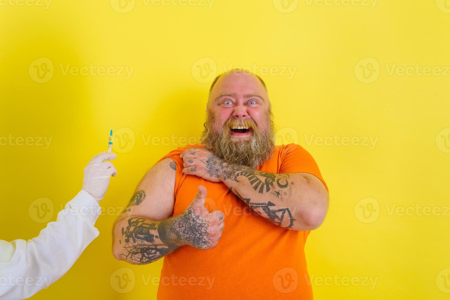 Happy man is happy of getting the covid-19 vaccine photo