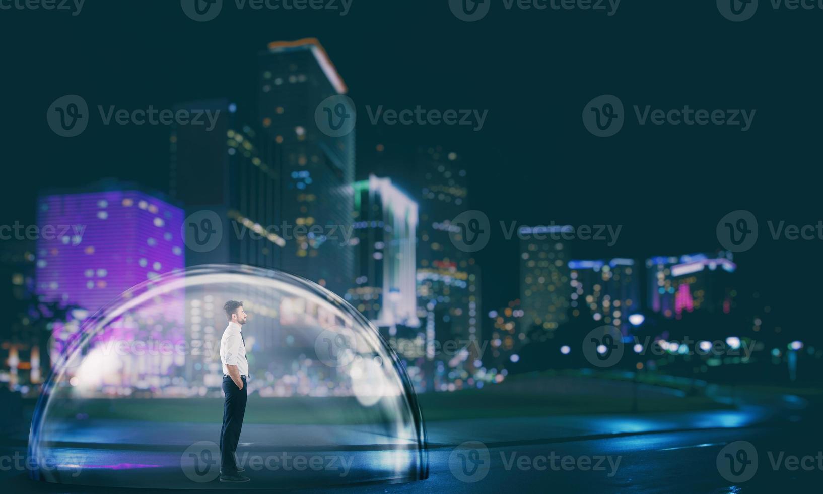 Businessman safely inside a shield dome in the city at night. Protection and safety concept photo