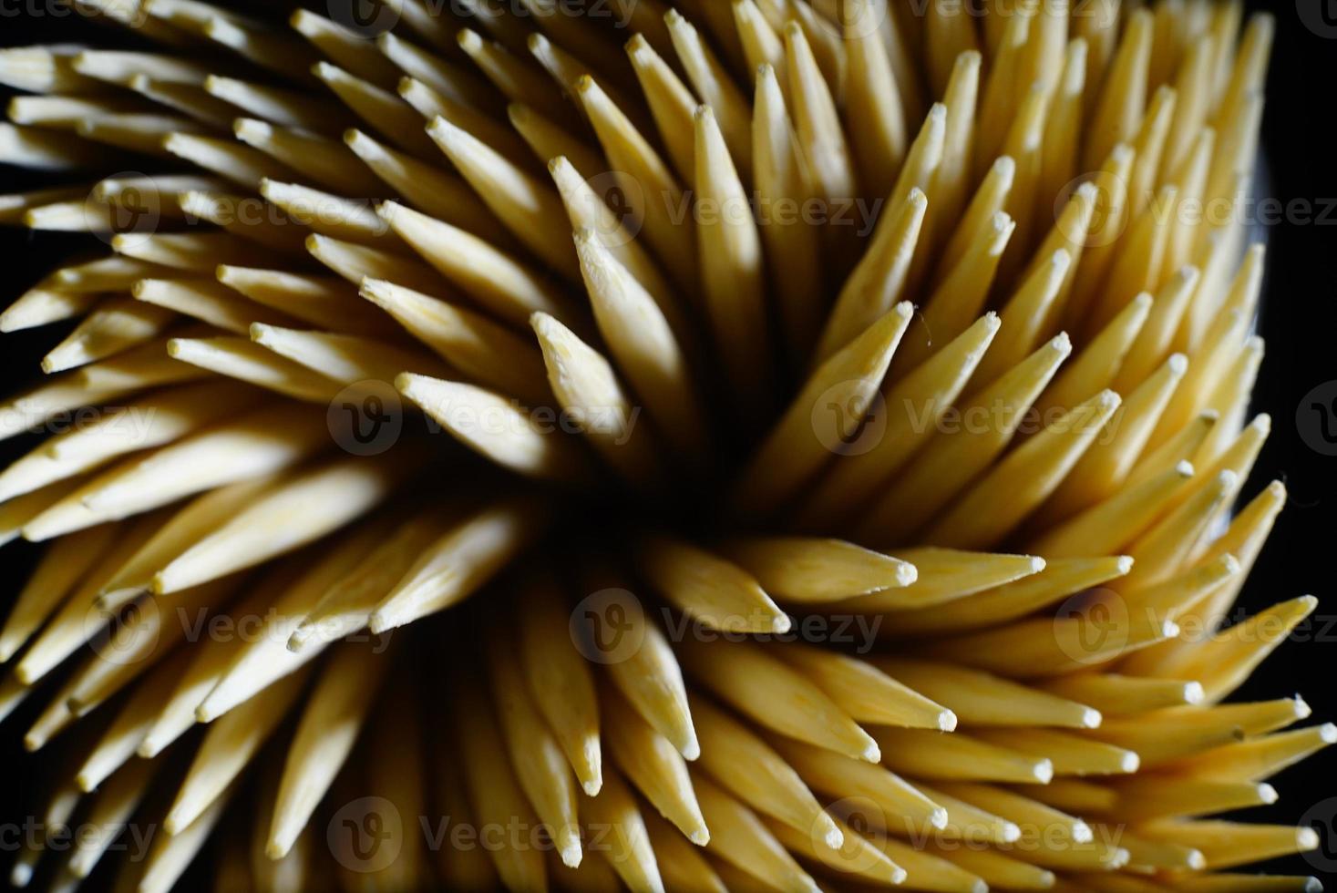 Top view of Toothpicks in black background. Macro shot of Toothpicks. Close up. Isolated photo