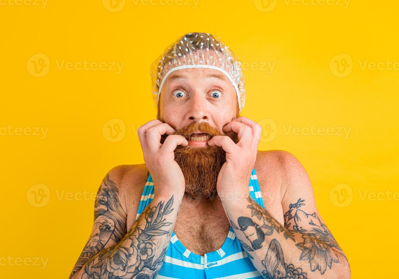 man with swimsuit and hair cap for women is ready for the summer photo