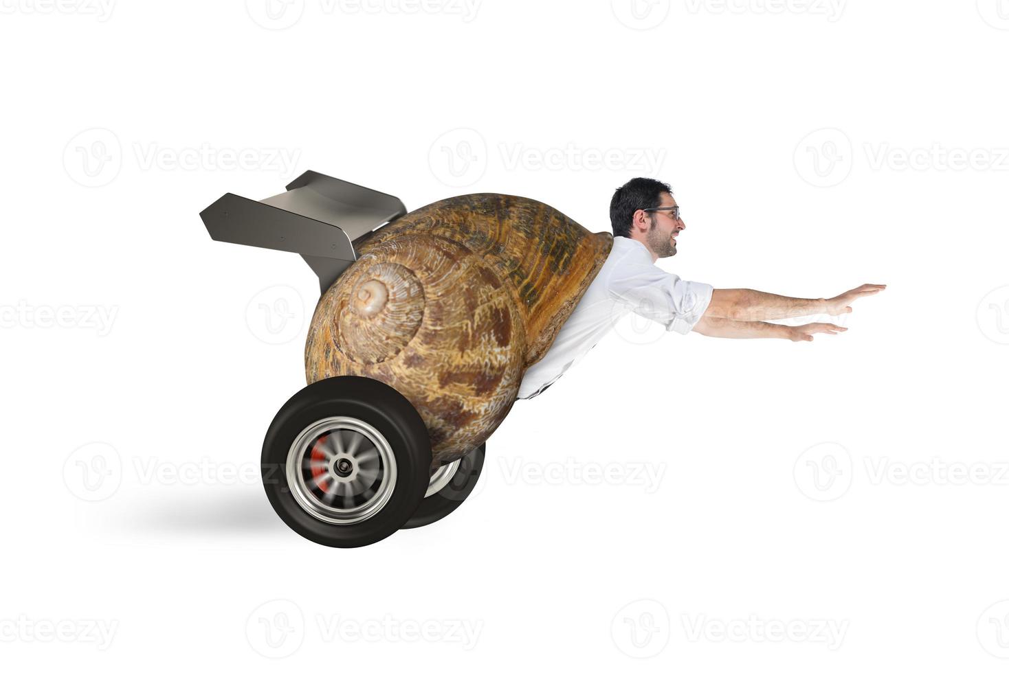Businessman like a snail runs fast as a race car photo