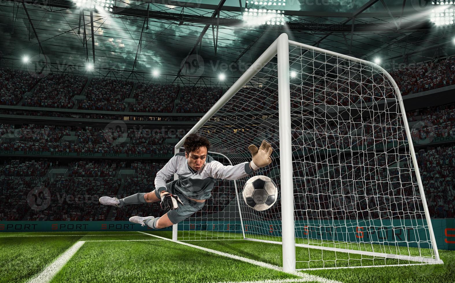 Soccer goalkeeper that makes a great save and avoids a goal during a match at the stadium photo