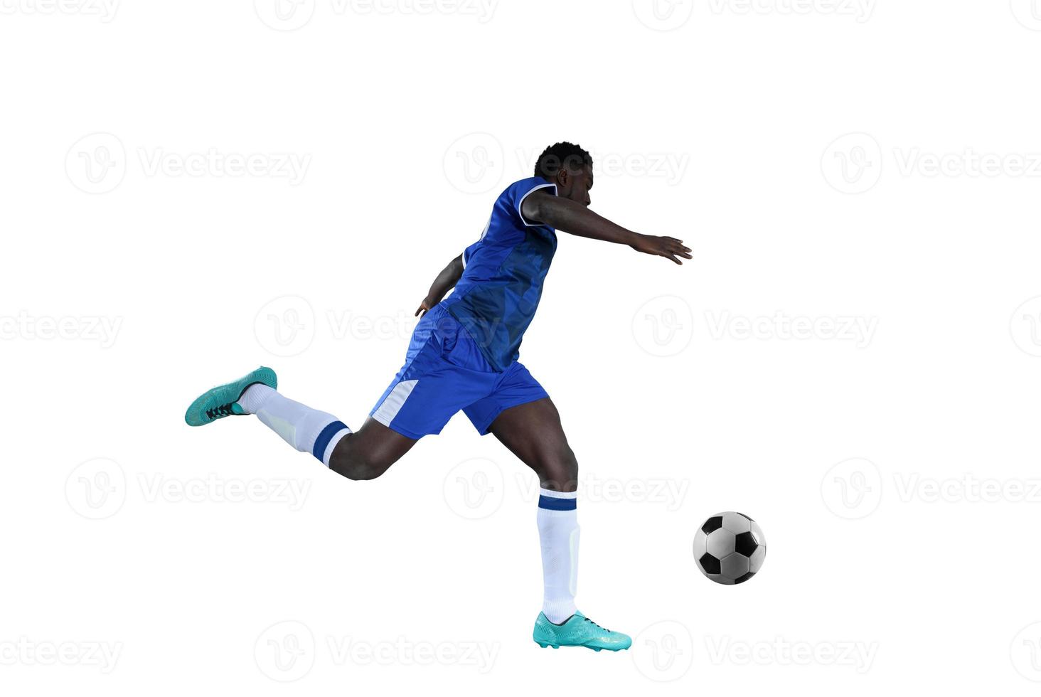 Football striker with blue team suit chases the soccerball photo