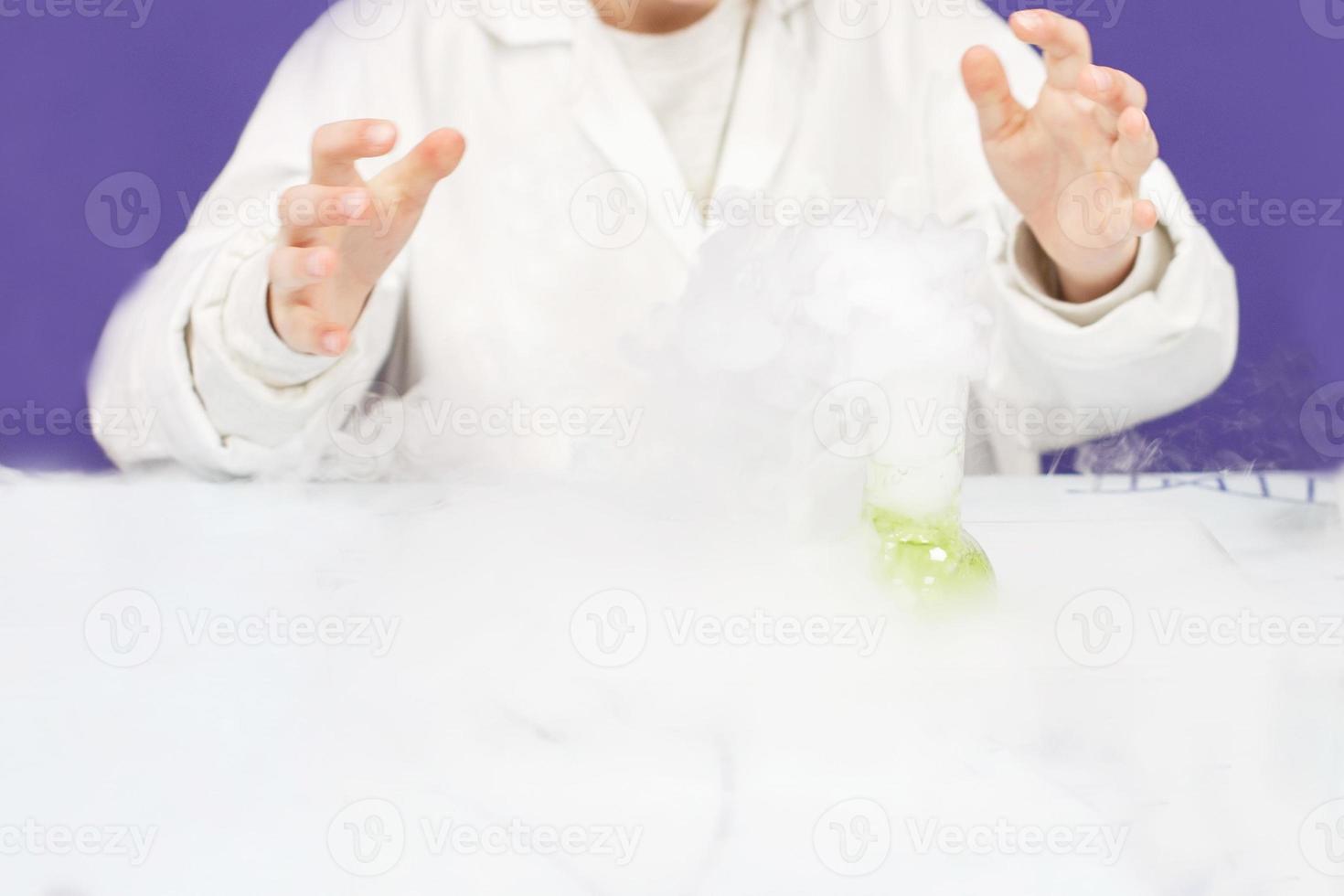 boy study science education. Chemical laboratory with test tubes for experiments and multi-colored liquids photo
