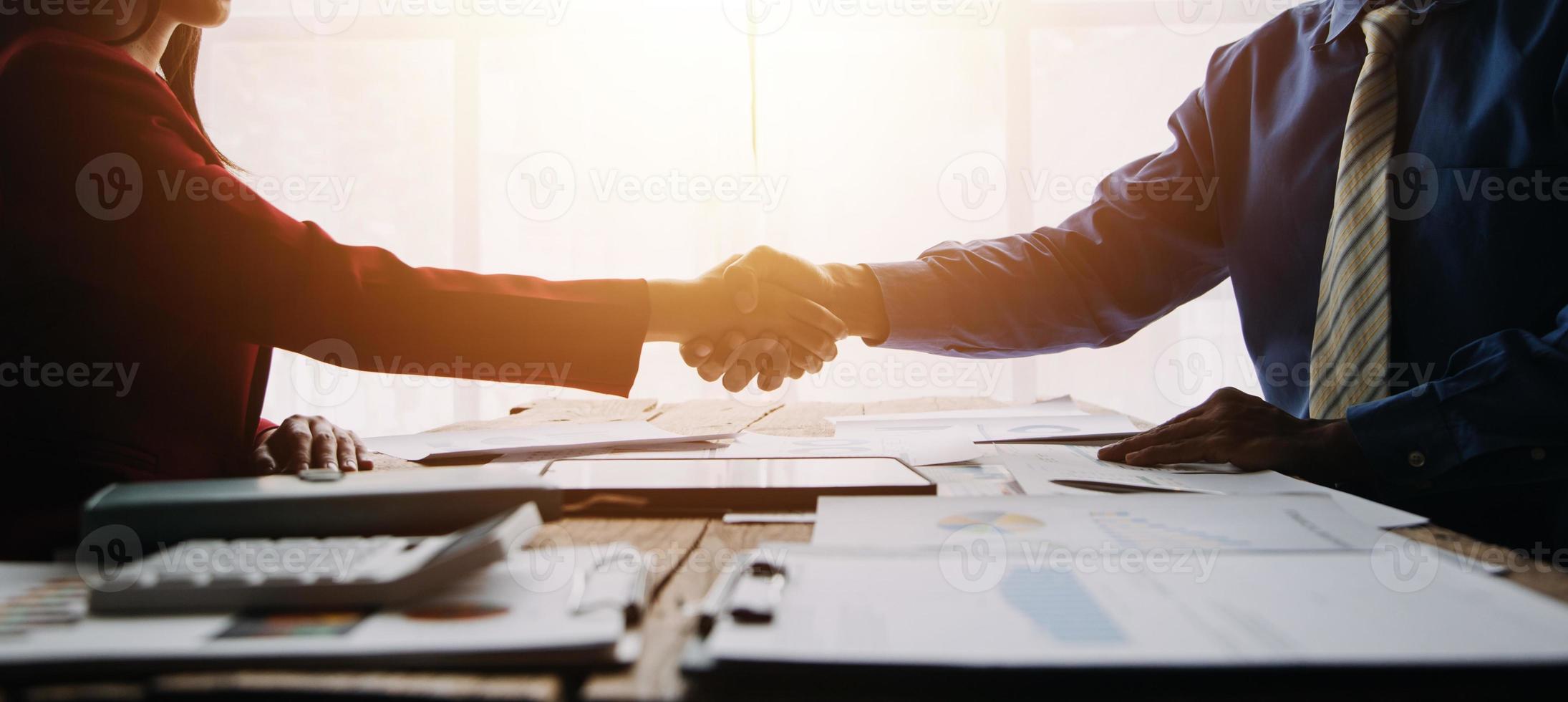 Businesswoman handshake and business people. Successful business handshake concept. photo