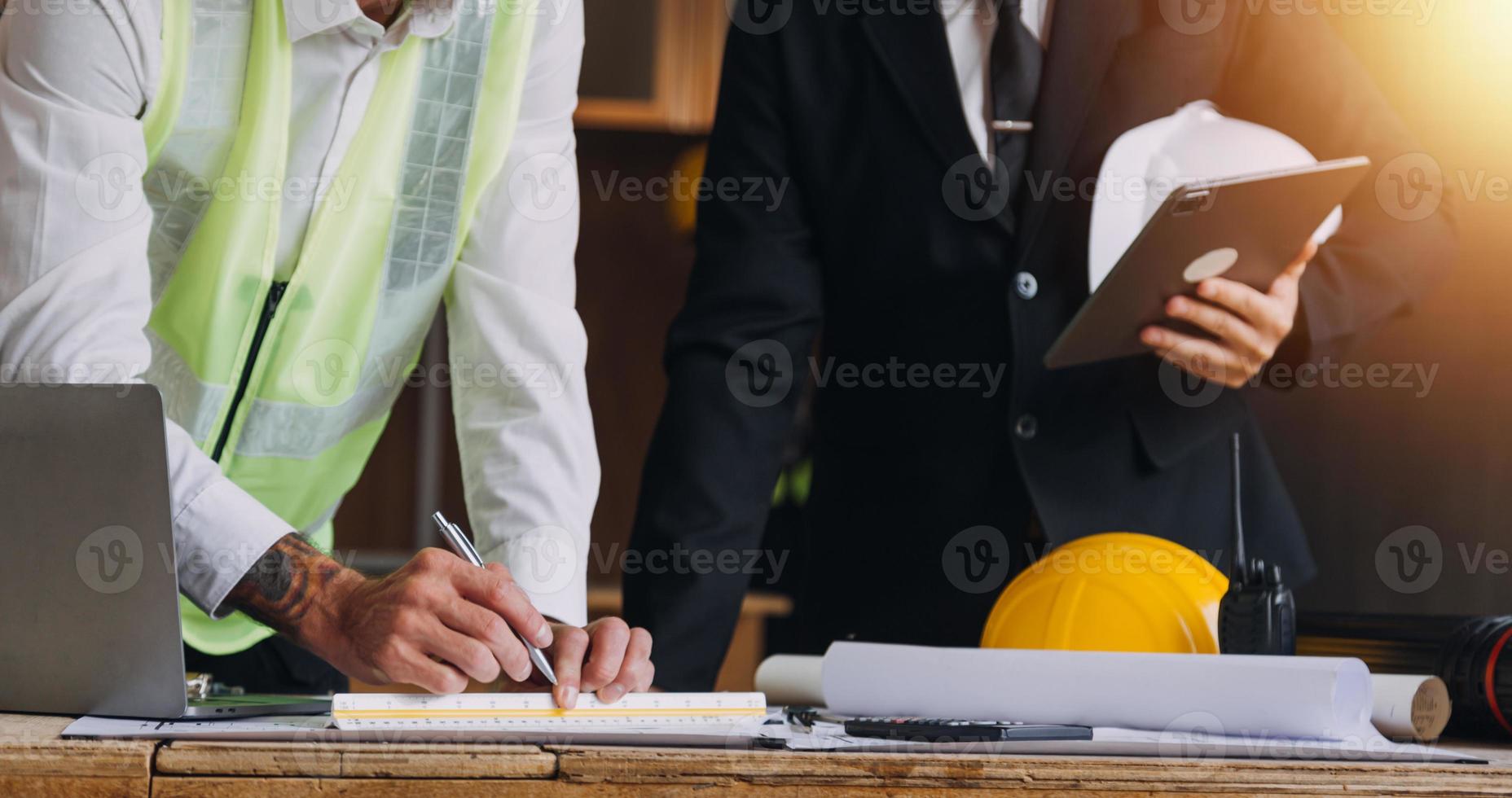 Architect concept, Architects working with blueprints in the office, Vintage Effect photo