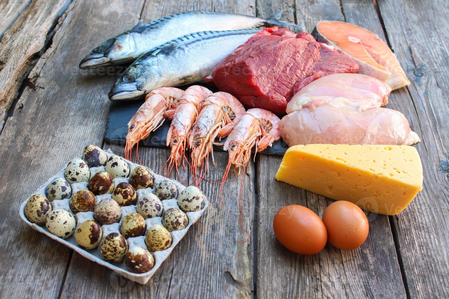 Healthy food of animal origin on old wooden background. Concept of proper nutrition. photo
