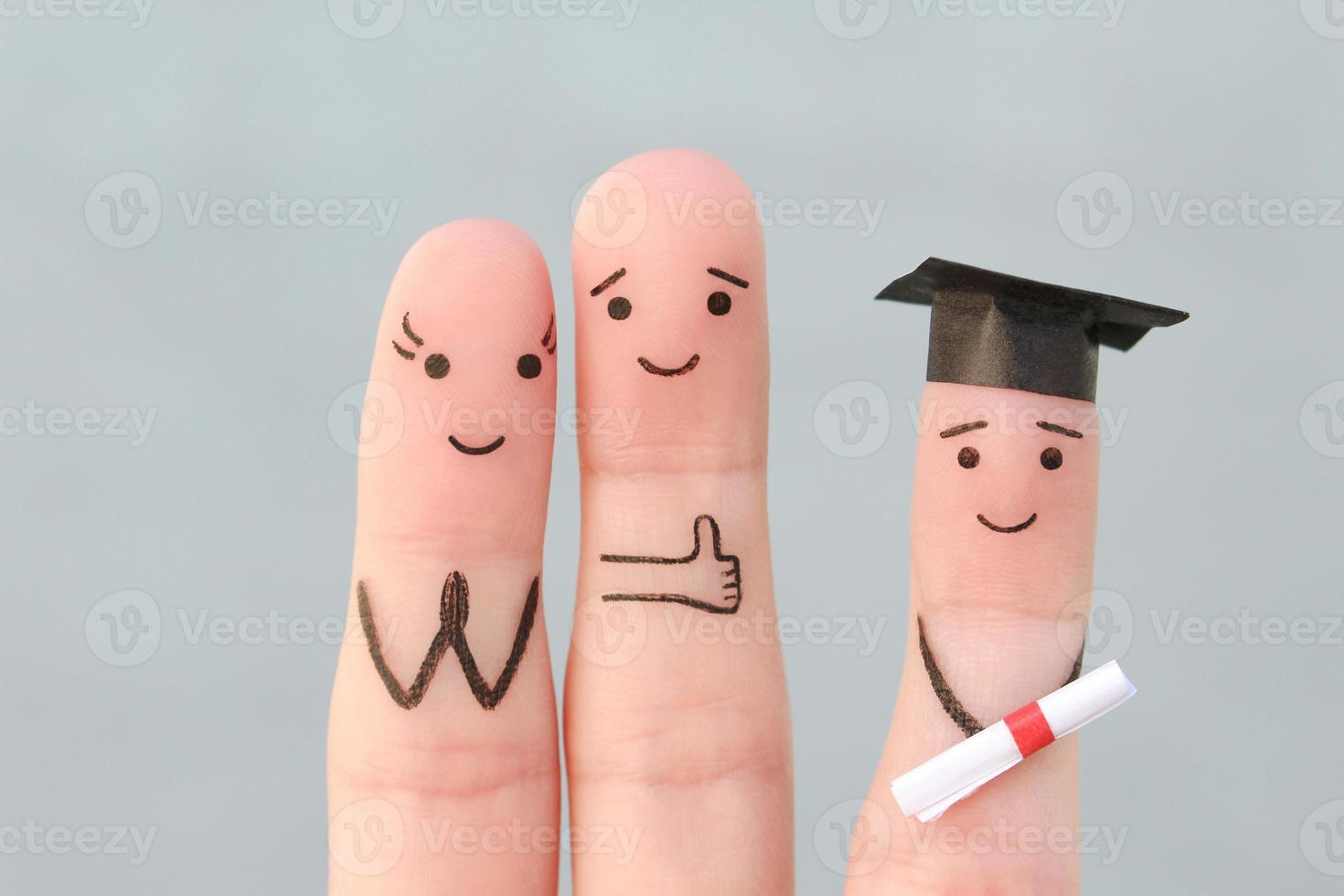 Fingers art of happy family. Concept parents are proud of their child graduated from college. photo
