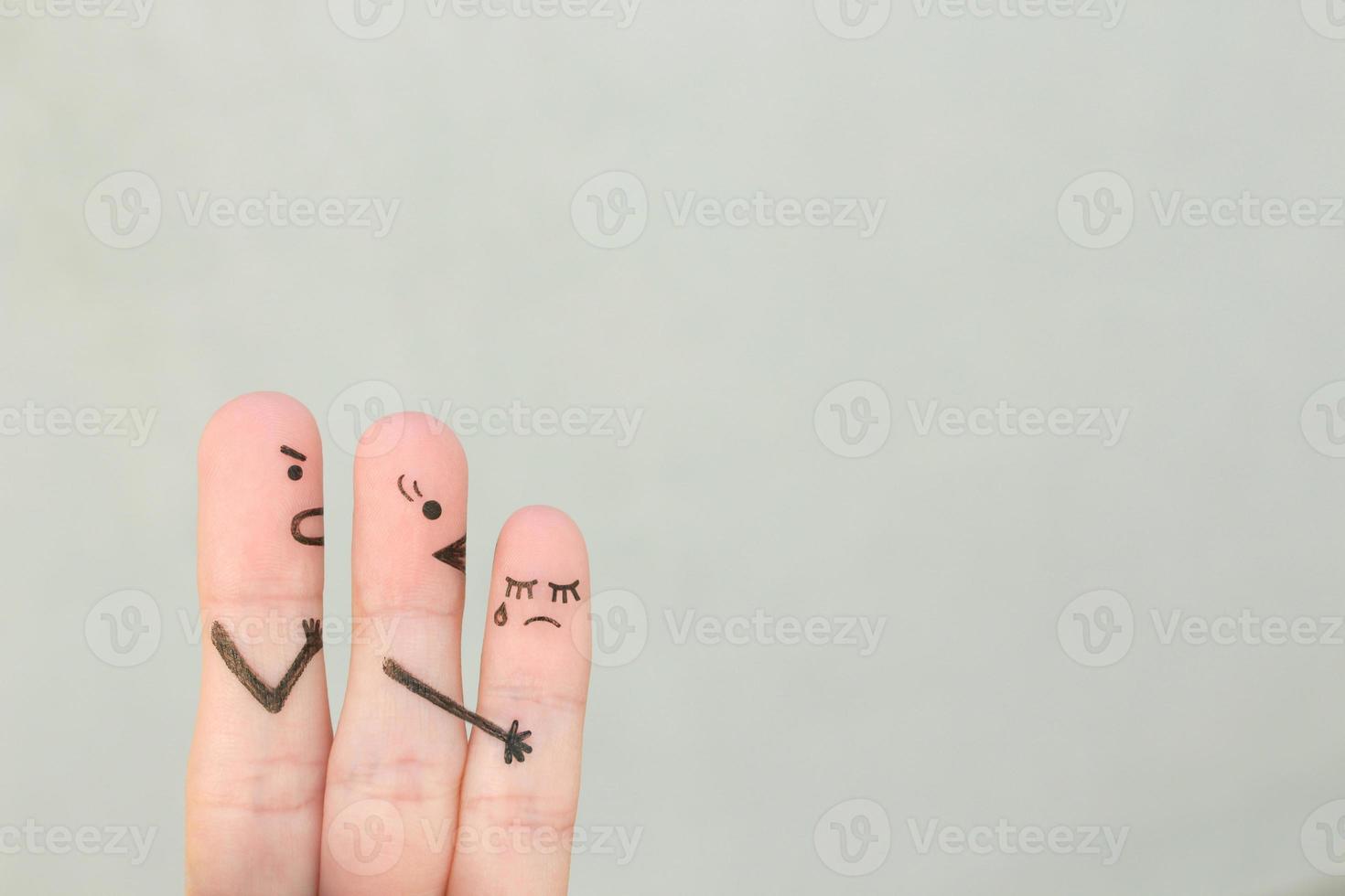 Fingers art of people during quarrel. Child cries, mother reassures his. photo