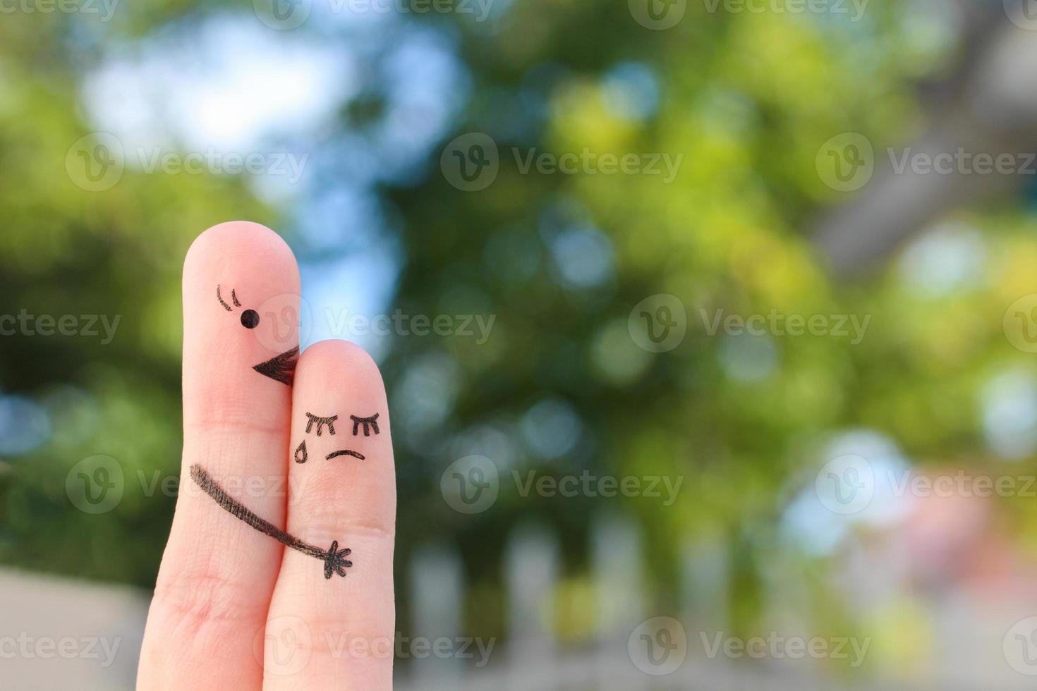 Fingers art of people. Child cries, mother reassures his. photo