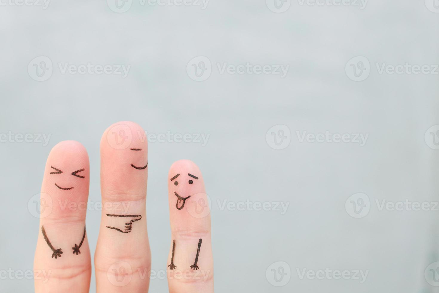 Fingers art of happy family. Concept of child makes face and parents laugh. photo