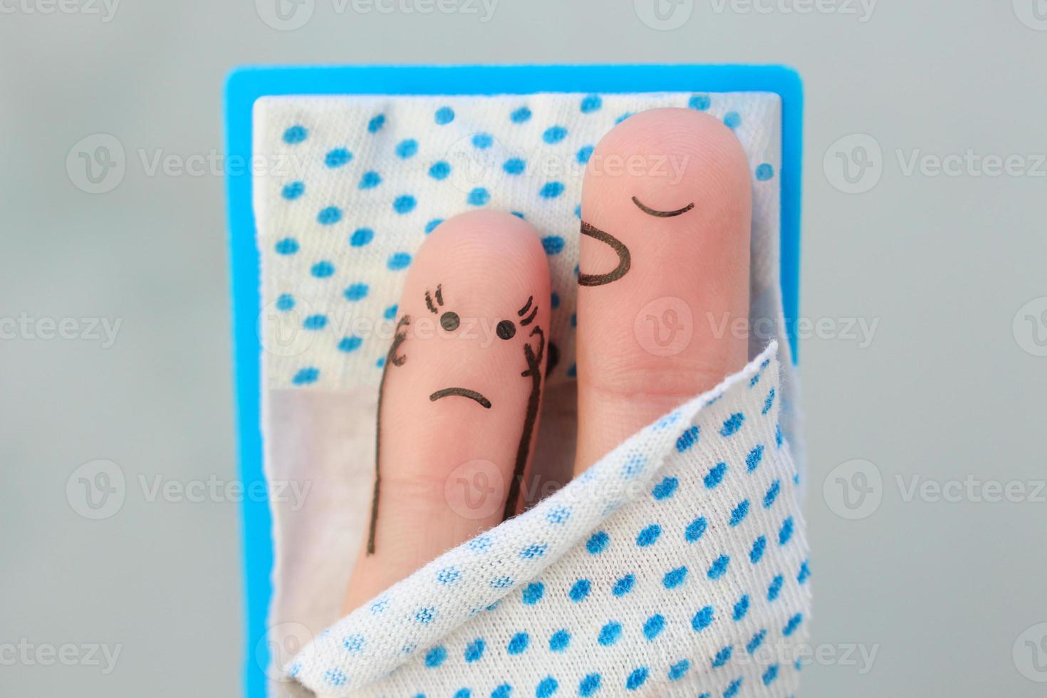 Fingers art of couple in bedroom. Concept of snoring husband annoys his wife. photo