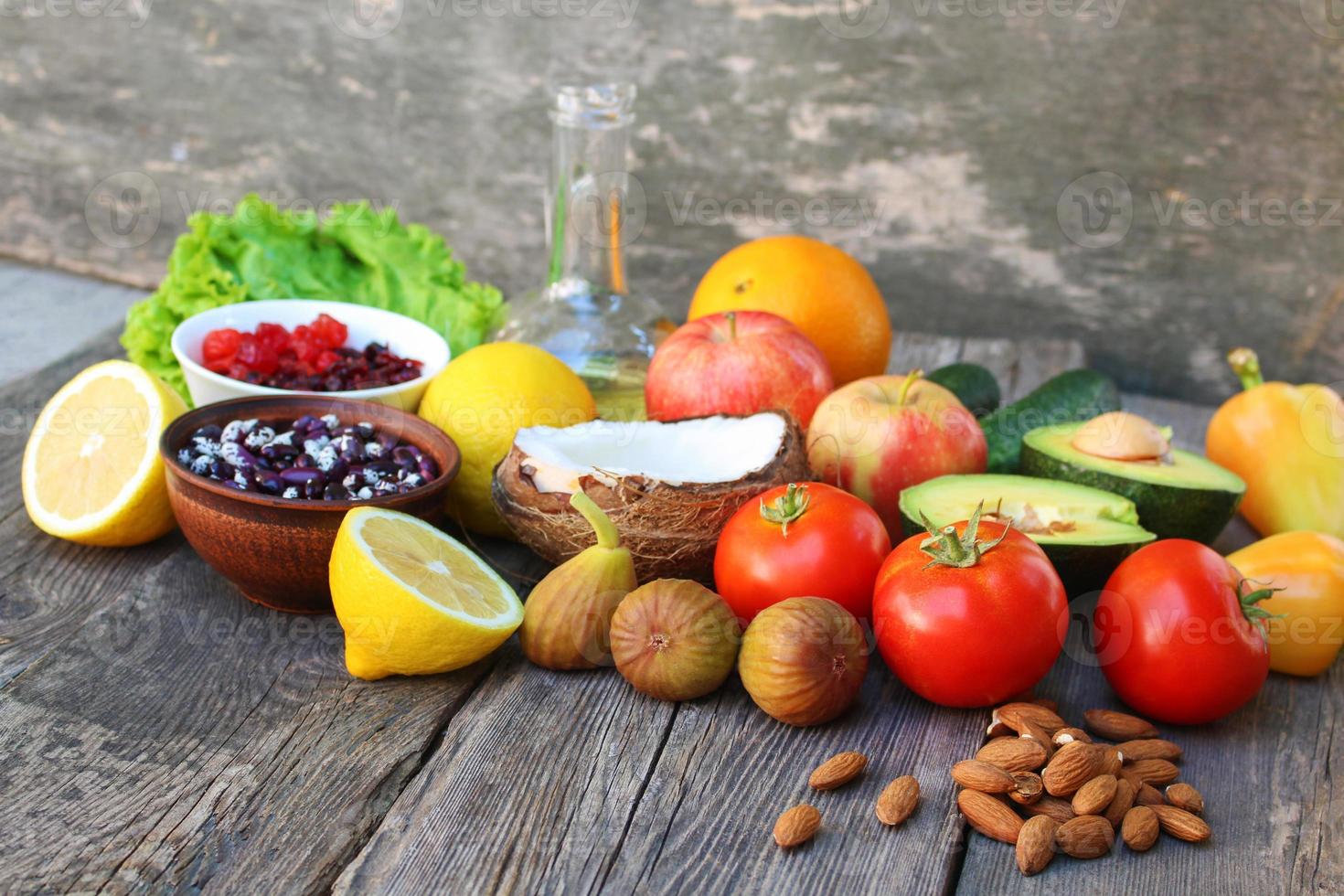 Healthy food of vegetable origin on old wooden background. Concept of proper nutrition. photo