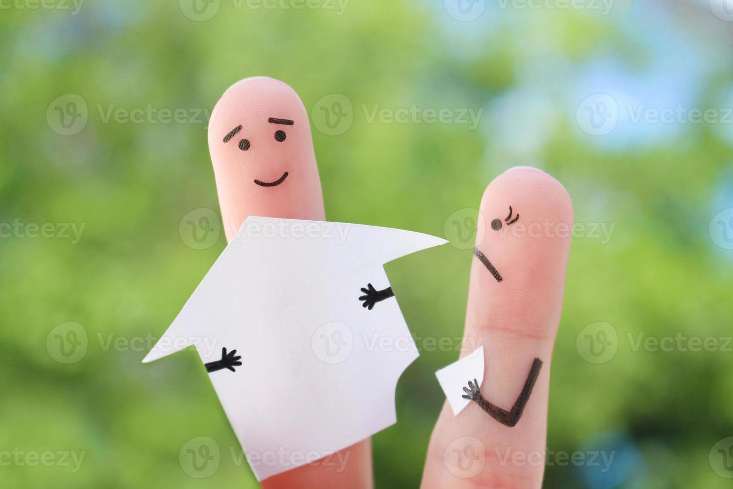 Fingers art of family during quarrel. Concept of man and woman divide house after divorce. photo