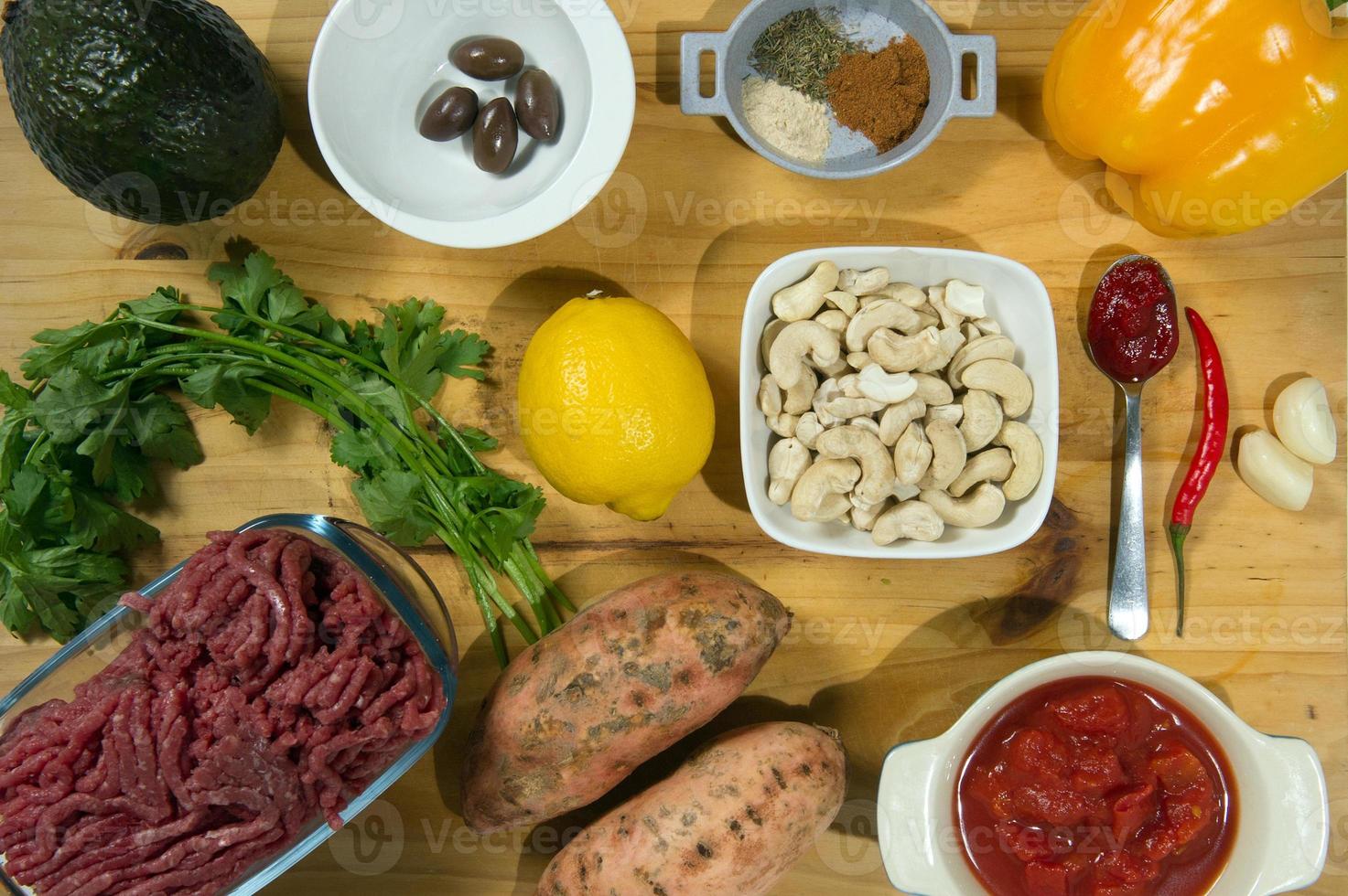 Raw ingredients. Ready to be cooked. Recipe for chiken stew, European cuisine, cooked with a garnish of mushrooms, small onions and ohter. photo