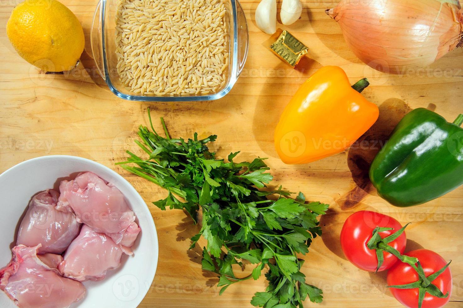 Raw ingredients. Ready to be cooked. Recipe for chiken stew, European cuisine, cooked with a garnish of mushrooms, small onions and ohter. photo