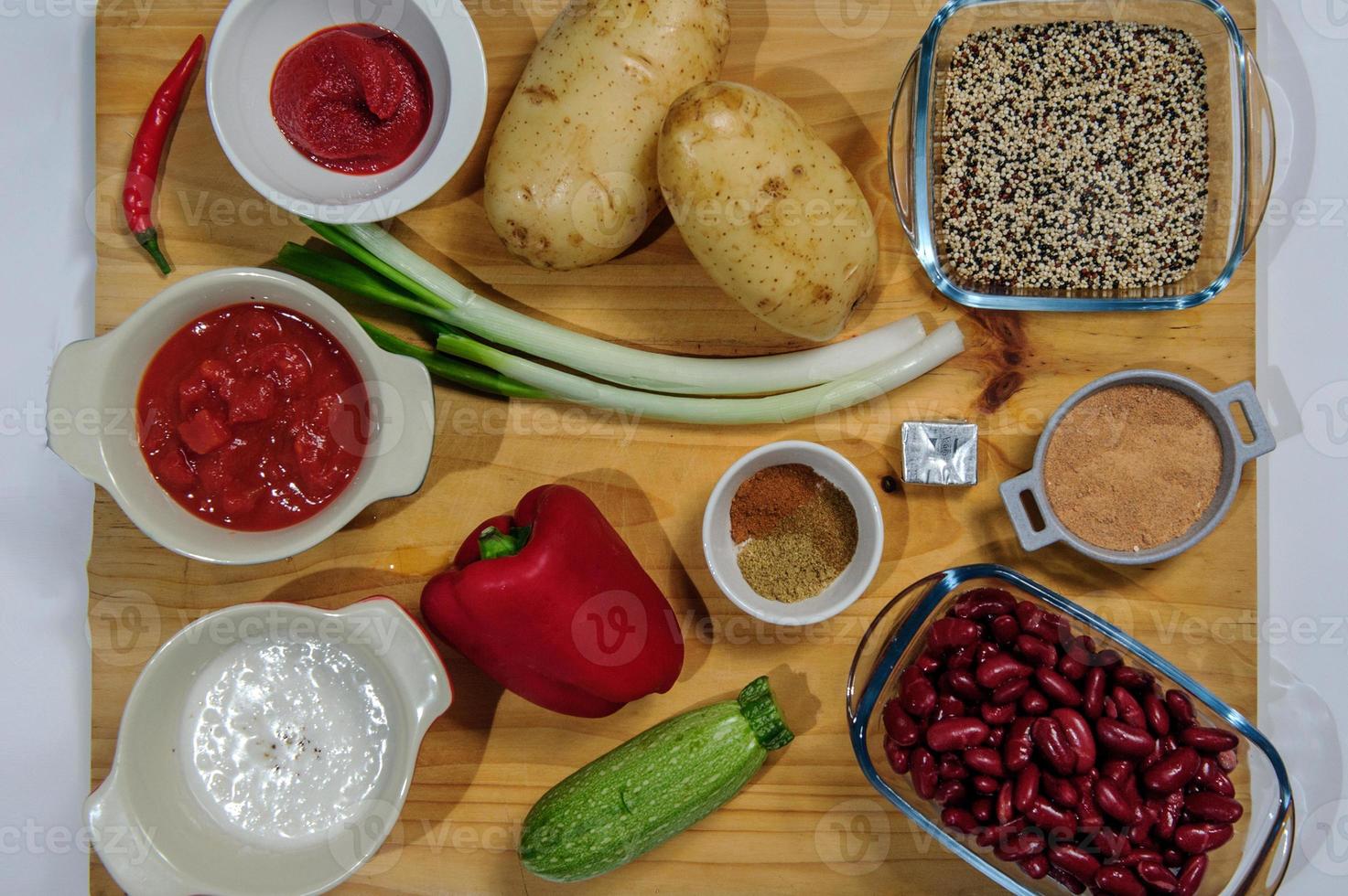 Raw ingredients. Ready to be cooked. Recipe for chiken stew, European cuisine, cooked with a garnish of mushrooms, small onions and ohter. photo