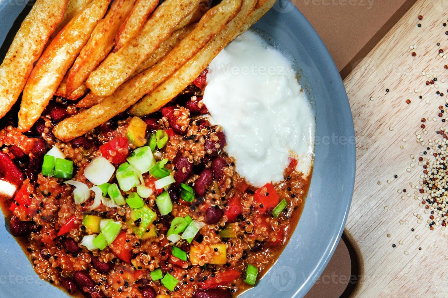 Fry fries with french bean or string beans with grounded beef. Served in plate. photo
