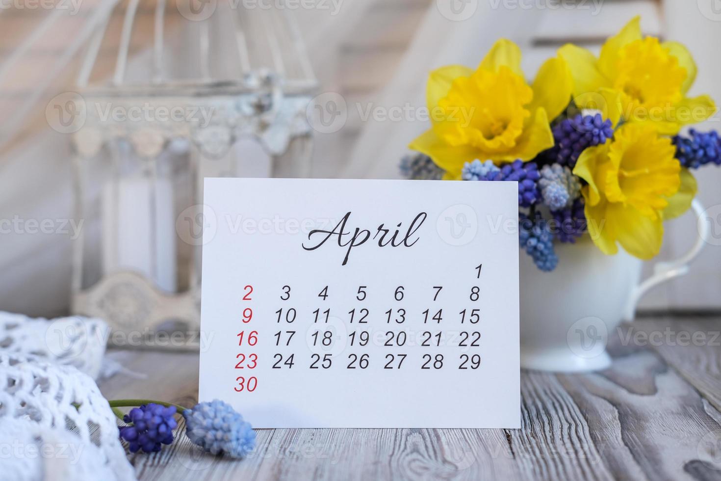 April calendar and spring flowers photo