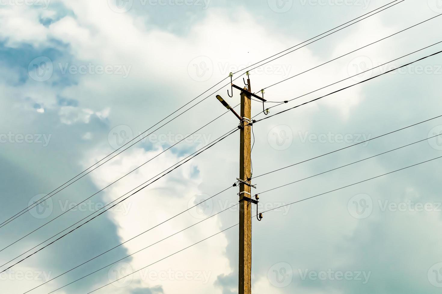 Power electric pole with line wire on colored background close up photo