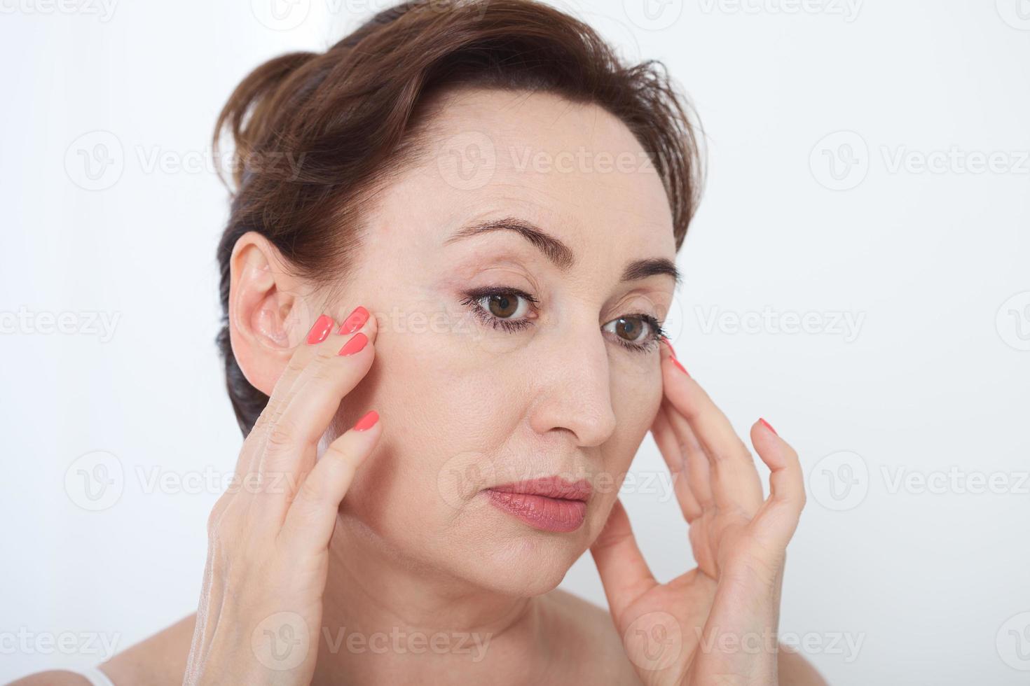 Fourty years. Wrinkles on forehead and face. Face plastic. photo