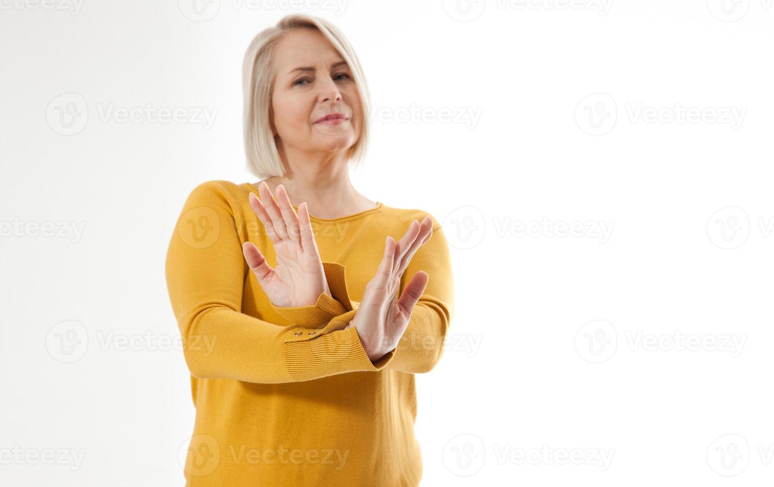 excited woman showing the sign of stop, neglect, negation and reluctance photo