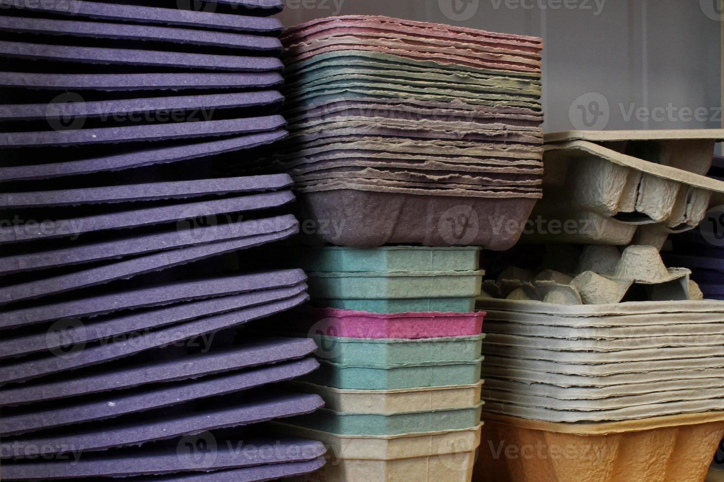 Eco package product from recycled pulp carton. Nature protection, environmental conservation, zerowaste, eco-friendly concept. Mold box from biodegradable waste paper material. Sustainable technology photo