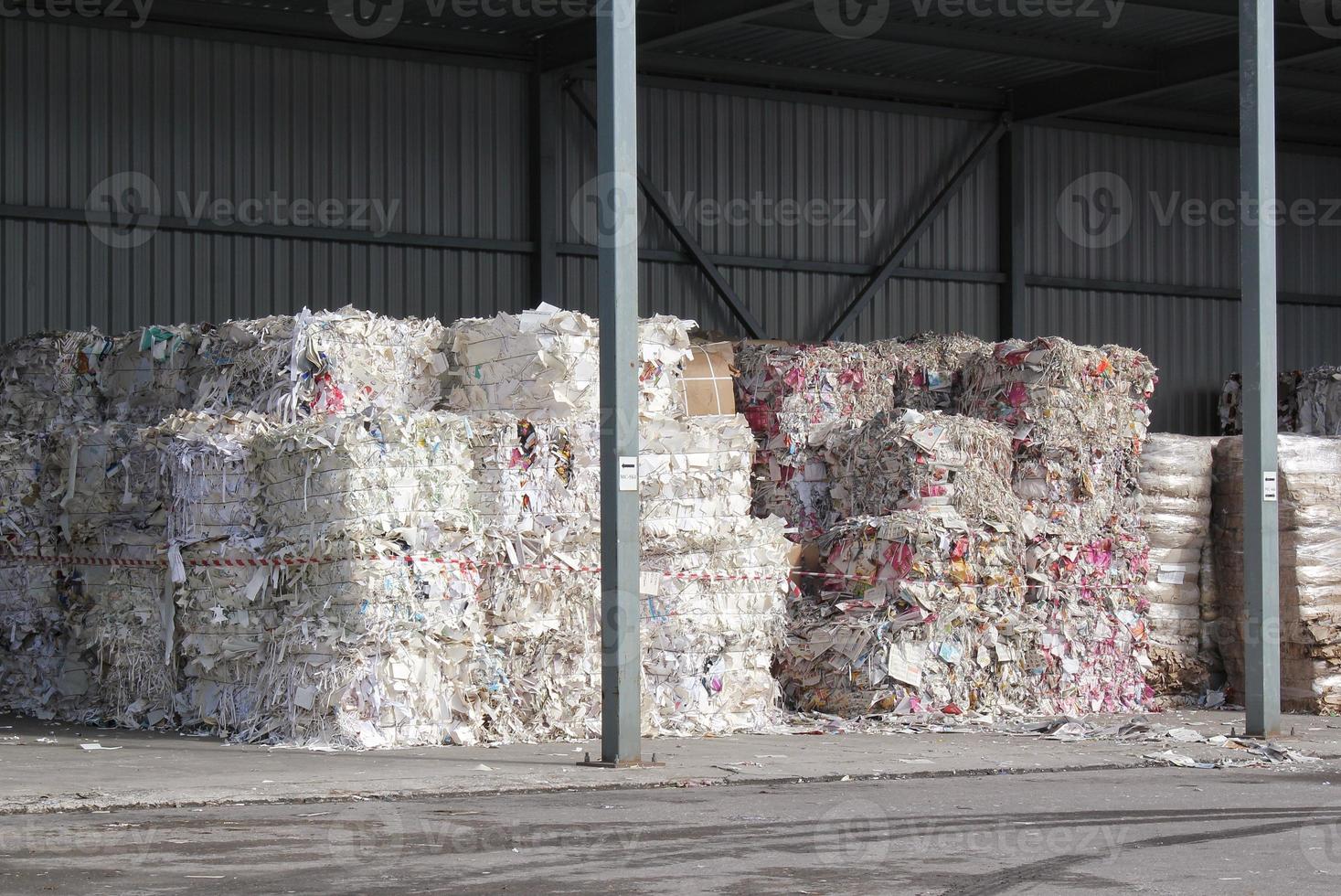 Wastepaper compact texture pile for recycling on sorting plant. Technology of reuse materials. Stack of shredded paper. Save the planet ecology concept. Industry of reduced pollution factory. Close-up photo