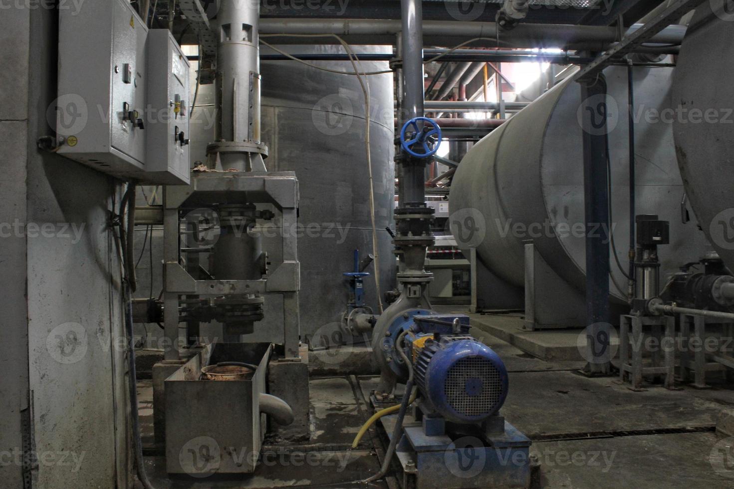 Steel pipes, tubes, steam turbine, valves, machinery, cables of modern factory. Gas boiler room of industrial zone power plant. Pump engineering station. Technical equipment system. Energy concept. photo