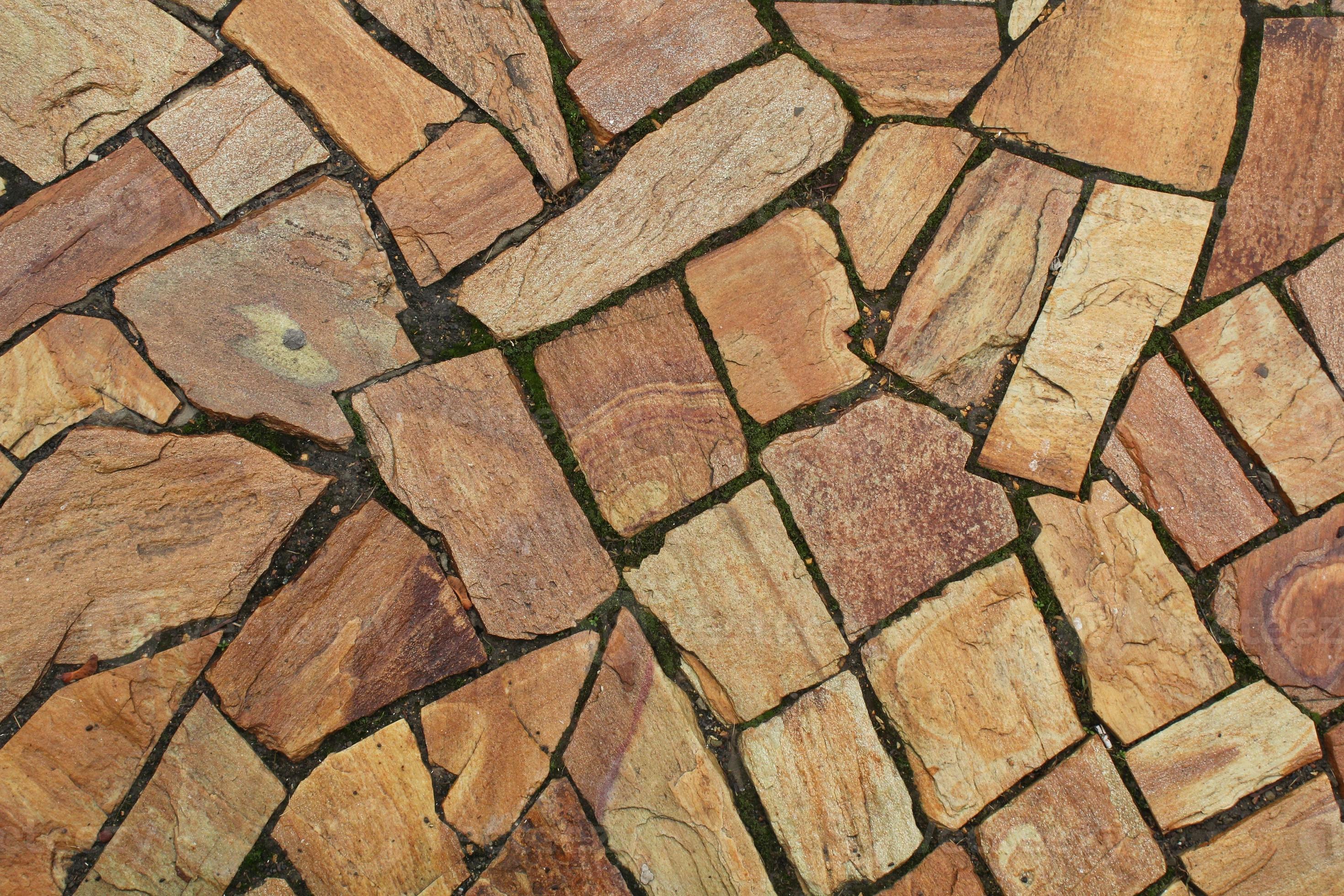 Cobble marble stone paving mosaic texture background. Natural brown