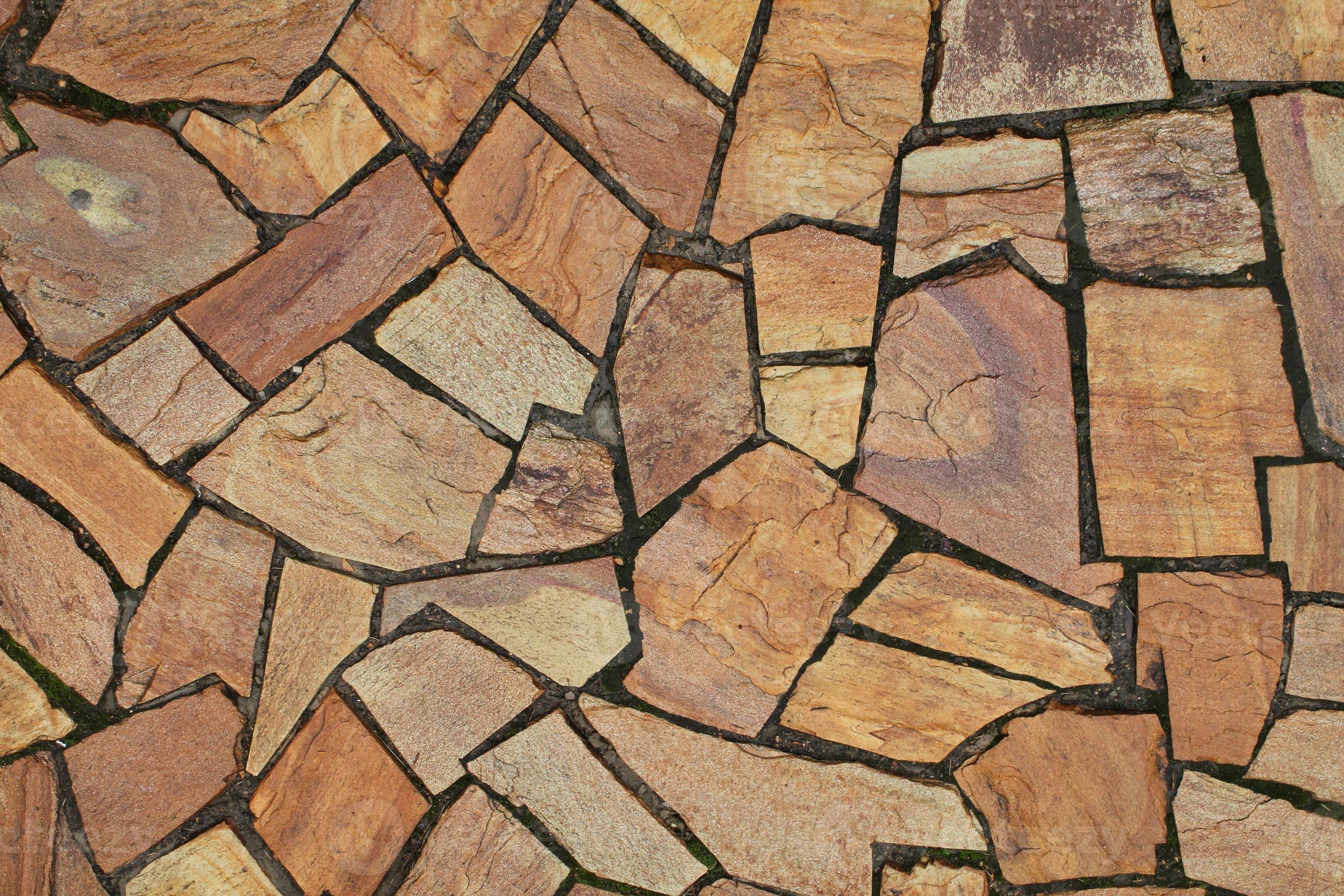 Cobble marble stone paving mosaic texture background. Natural brown