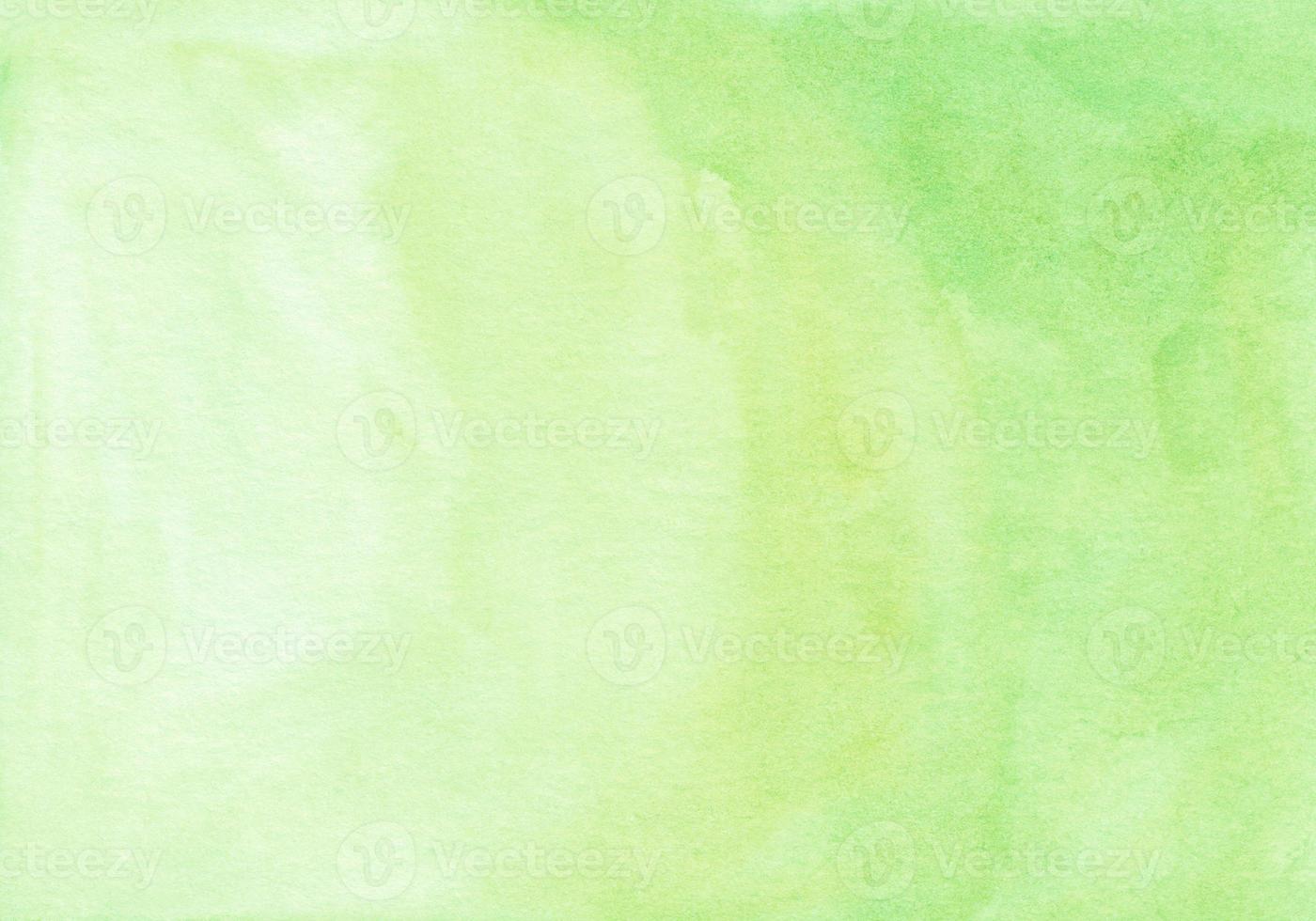 Watercolor light yellow green color background texture. Watercolour lime gradient hand painted. Stains on paper. photo