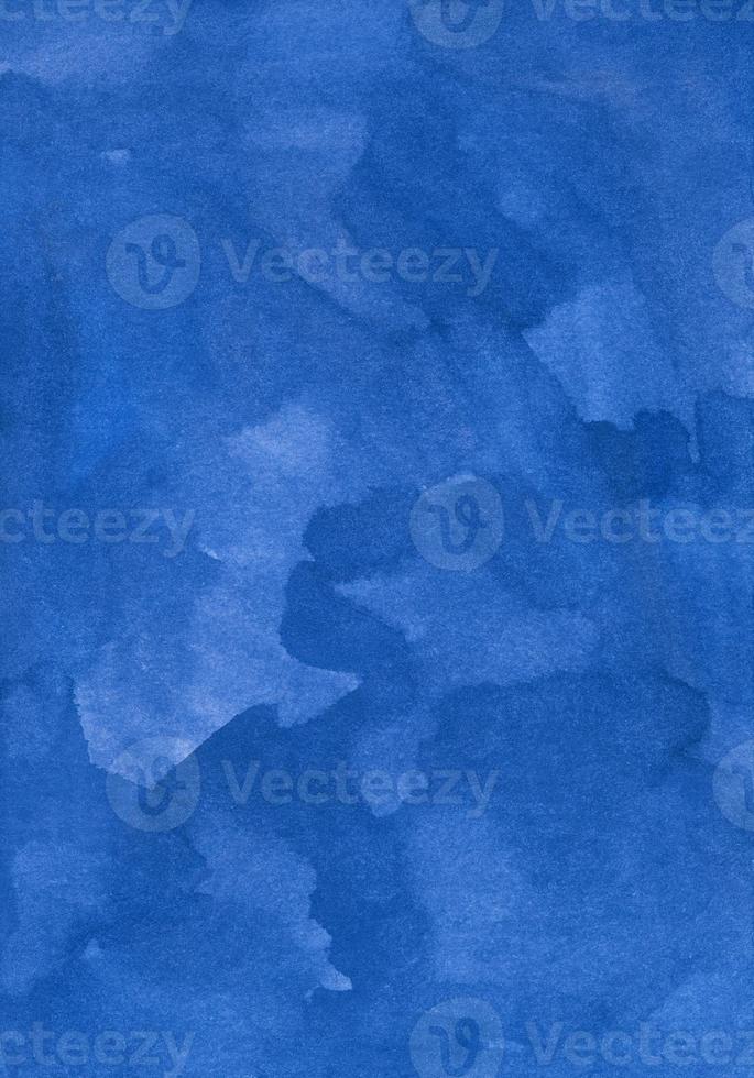 Watercolor deep blue background texture hand painted. Aquarelle azure blue abstract backdrop. Stains on paper photo