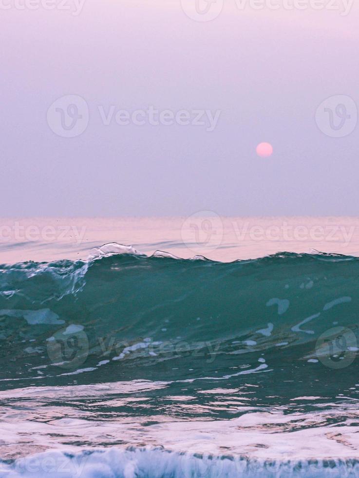 Bubbles on golden beach with ocean water in the morning at Thailand beaches. photo