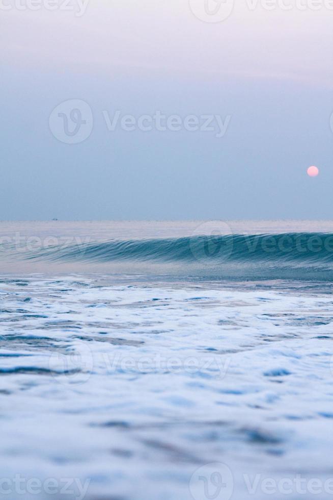 Bubbles on golden beach with ocean water in the morning at Thailand beaches. photo