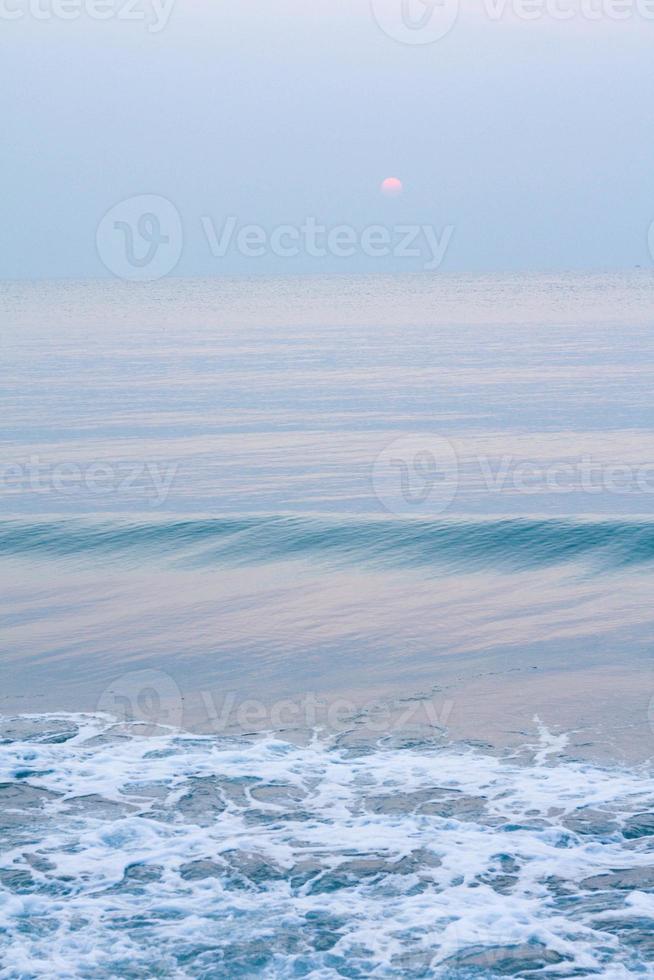 Bubbles on golden beach with ocean water in the morning at Thailand beaches. photo