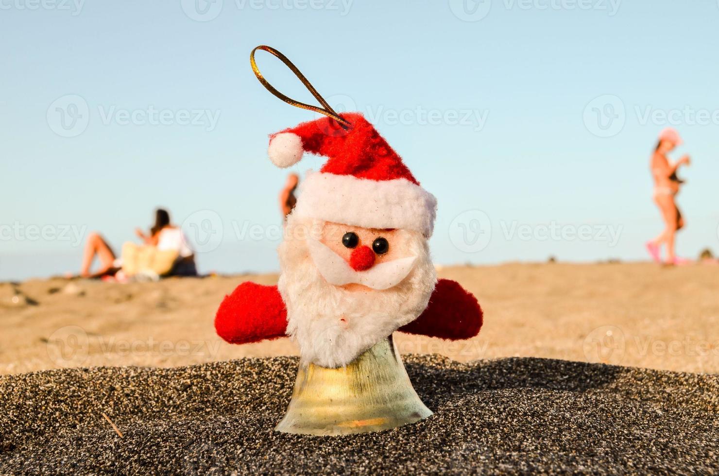 Christmas ornament on the sand photo