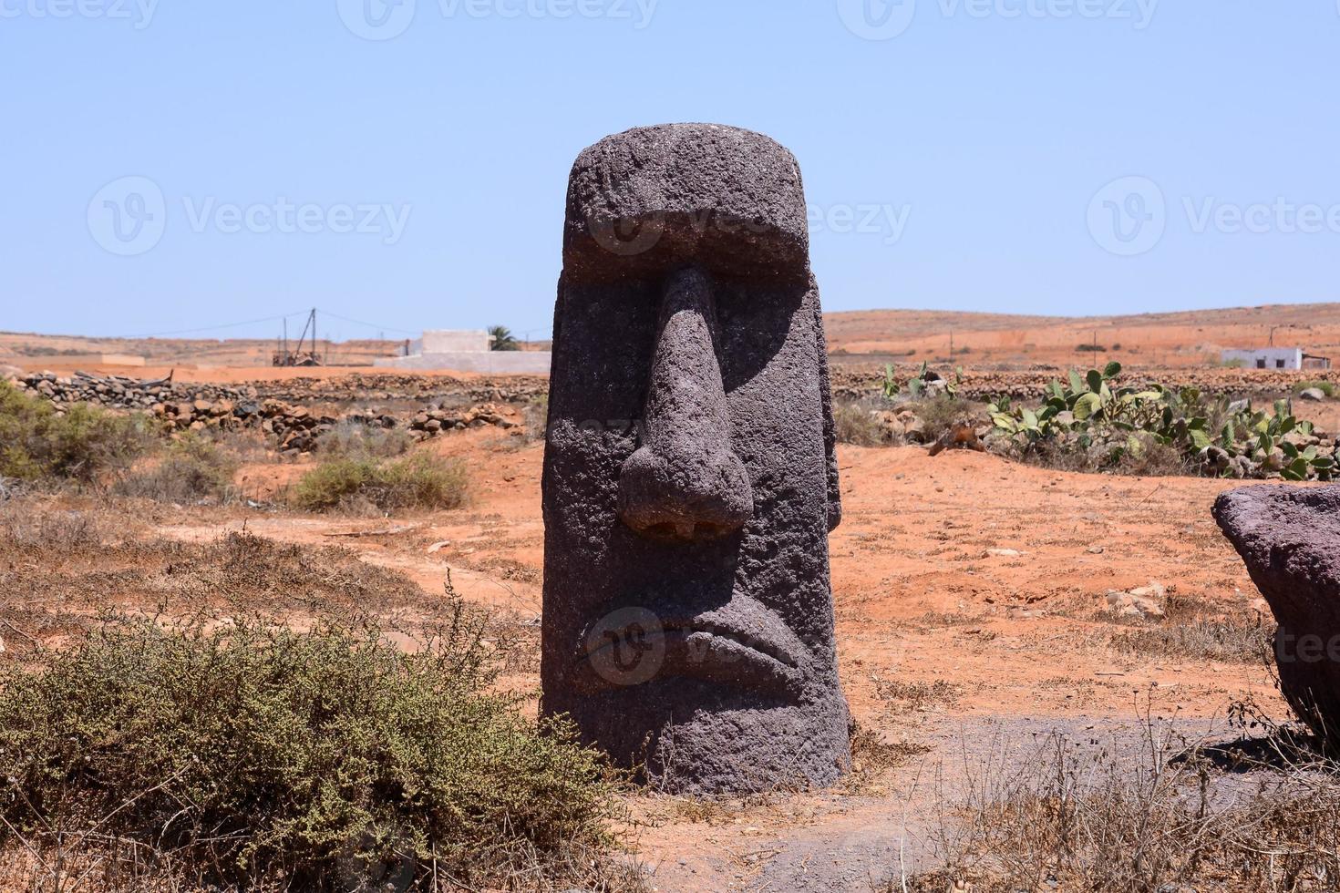 View of a desert landscape with Moai head photo