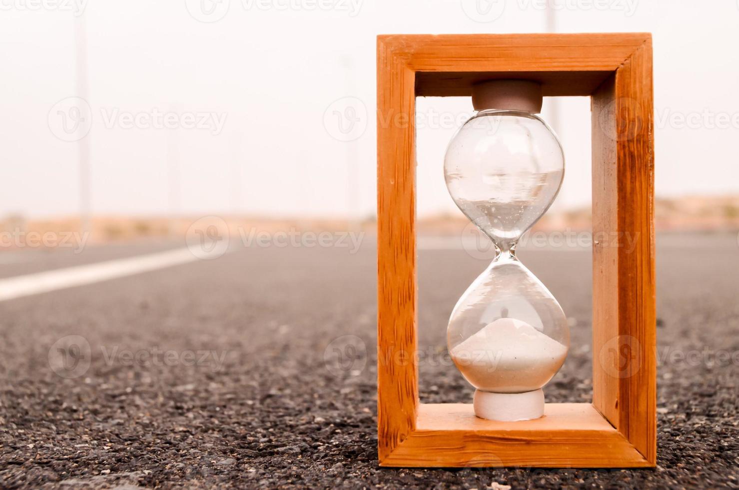 Hourglass on the road photo