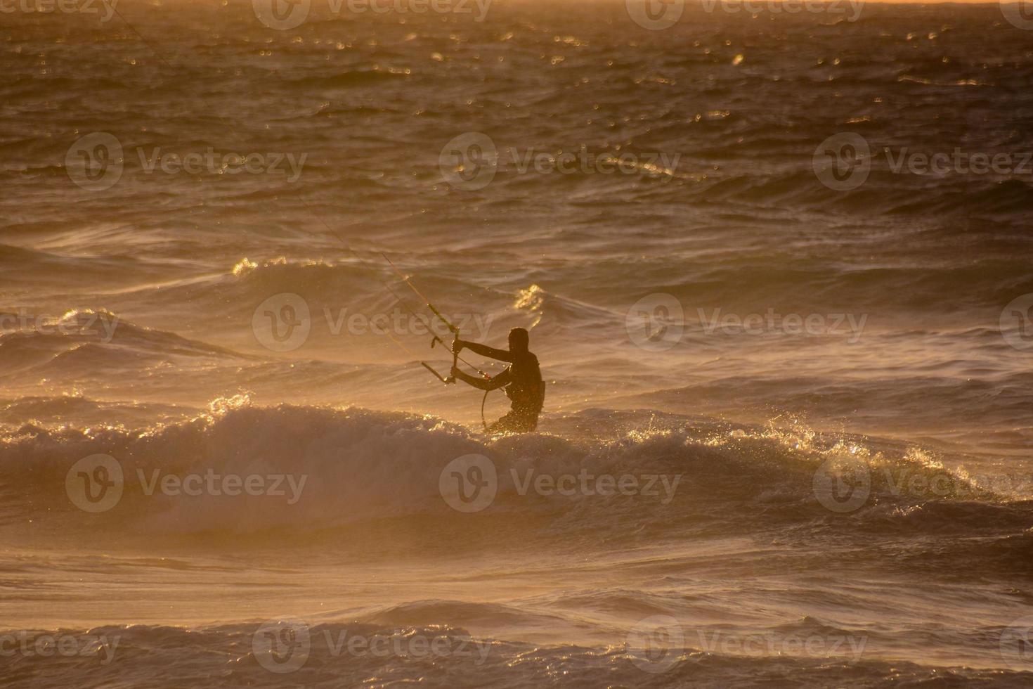 Kite surfer at sunset photo