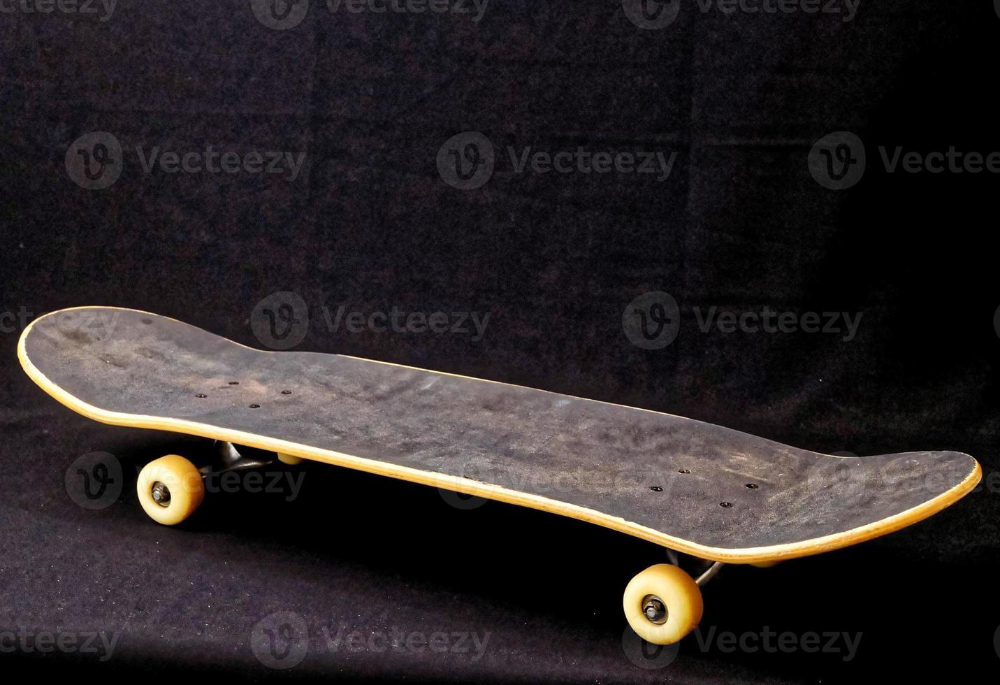 Skateboard on dark background photo