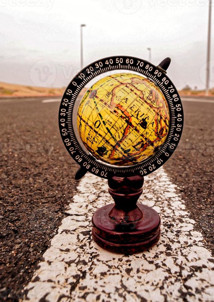 Globe on the road photo